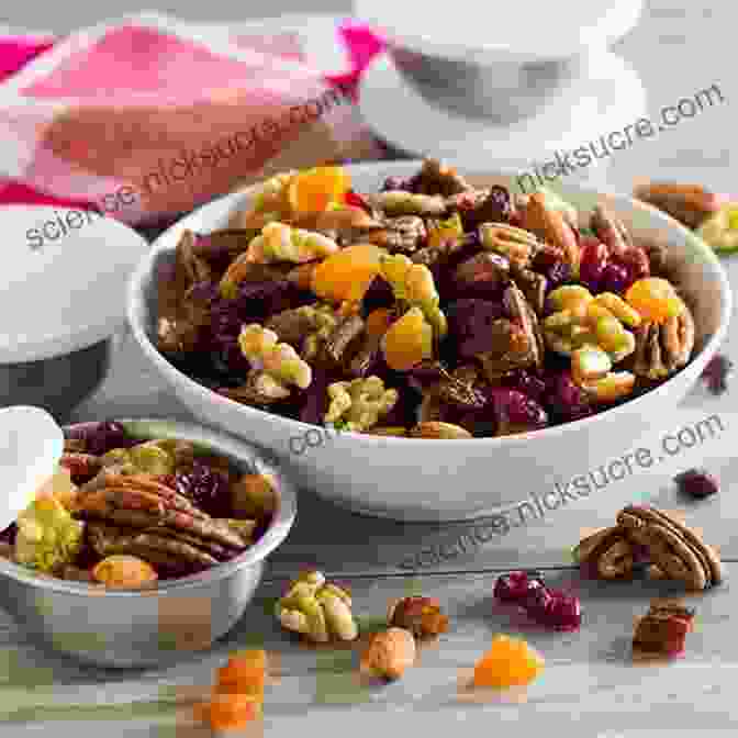 A Bowl Of Homemade Trail Mix With Nuts, Seeds, Dried Fruit, And Chocolate Chips Outdoor Griddle Cookbook : Healthy And Delicious Breakfast Lunch Dinners And Snakes Recipes Also More Recipes For All Ages