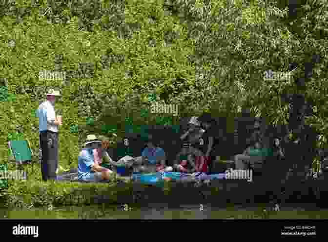 A Family Enjoys A Picnic On The Banks Of A River. Bright Rivers: Celebrations Of Rivers And Fly Fishing